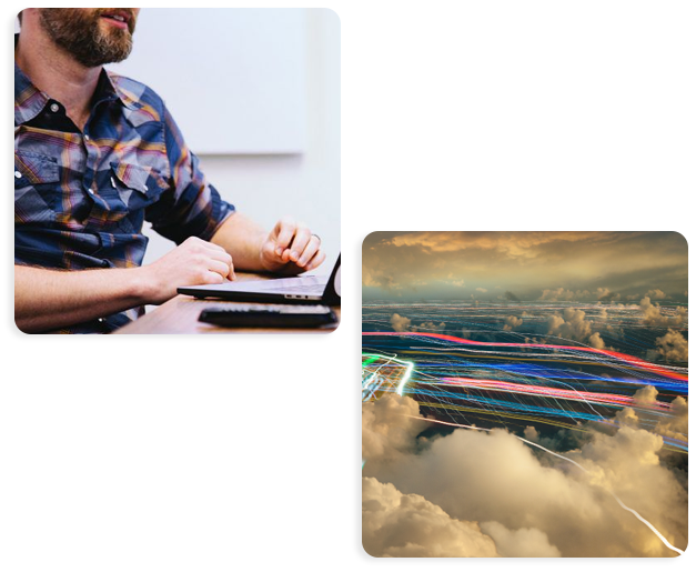 Man on laptop, light trail in clouds